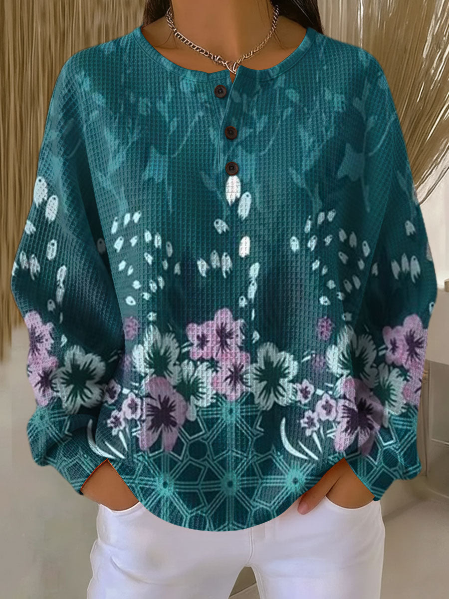 Pullover med blomsterdesign